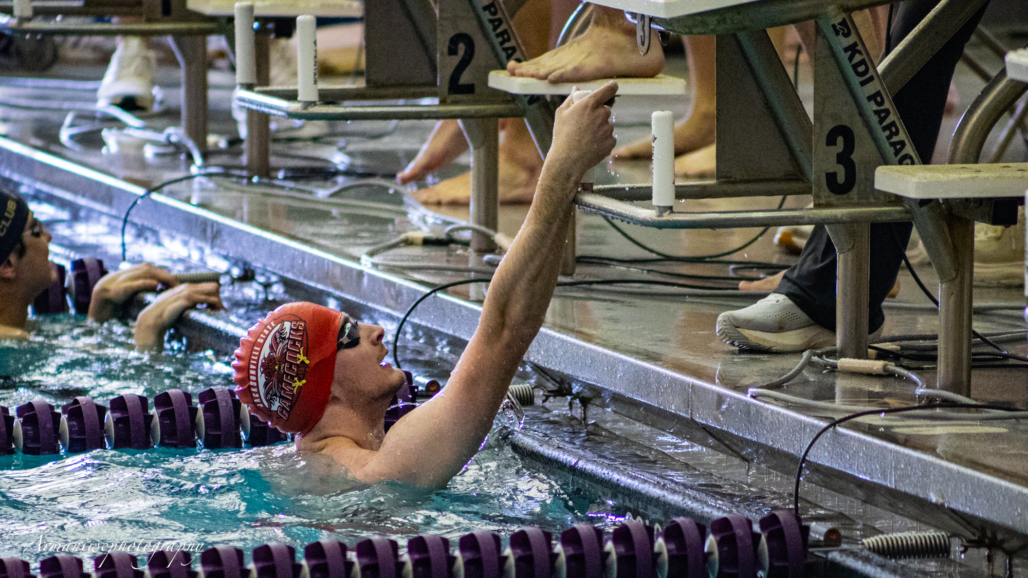 Perry finishing a competitive swim race